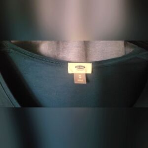 Blue green blouse with a ballet neckline.